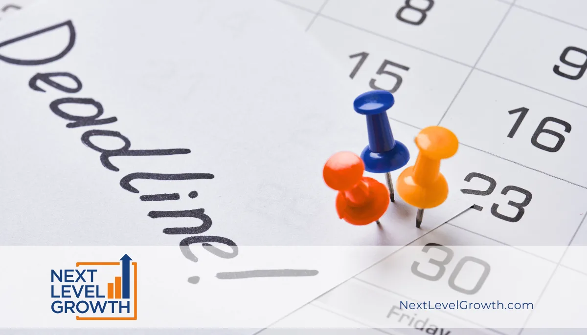 A calendar page with "Deadline!" written on it, marked by three colored push pins on key dates—perfect for Elite Leaders tracking New Year’s Goals. The Next Level Growth logo is in the bottom left corner.
